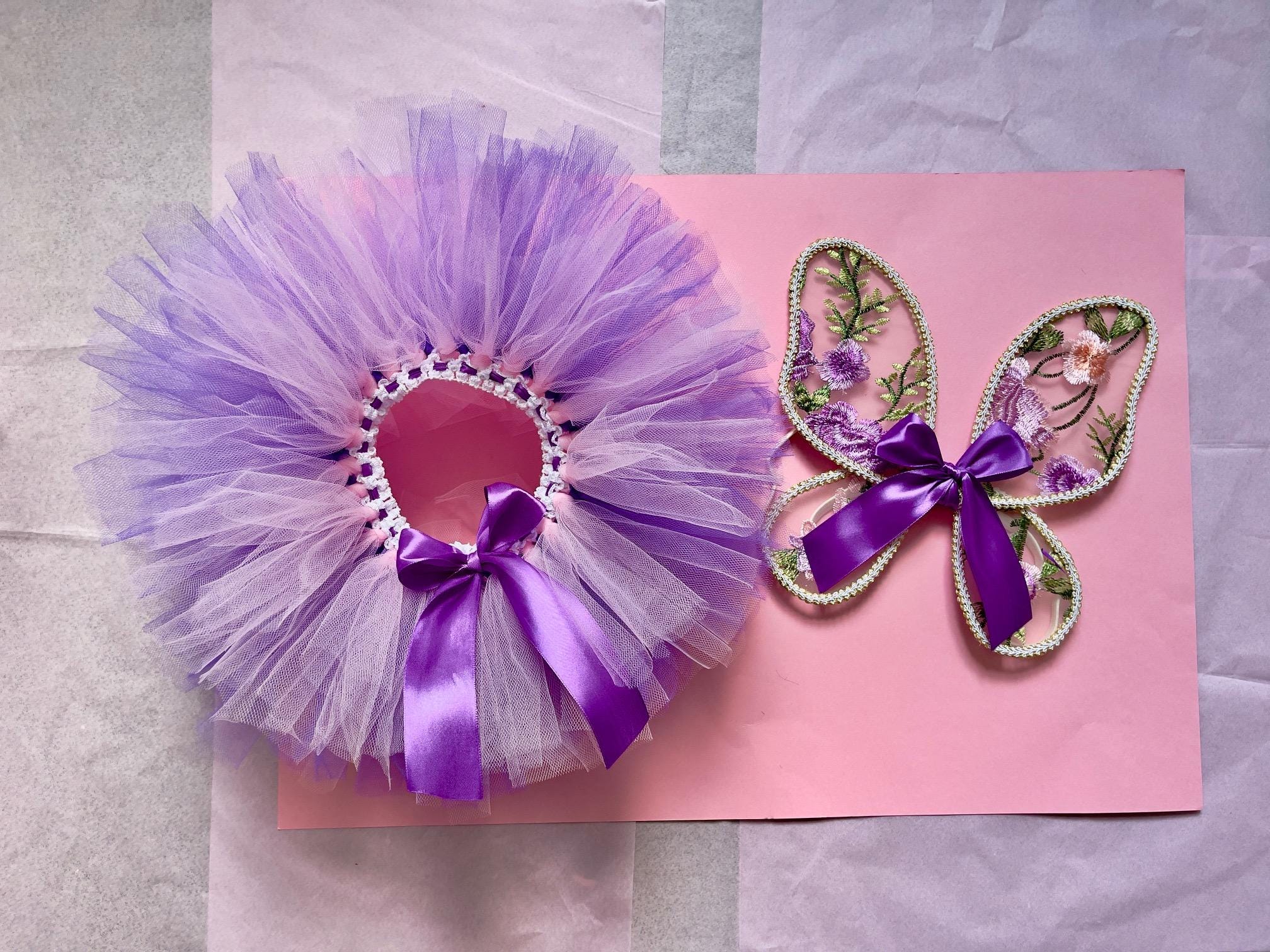Fairy wings and tutu for babies. Tulle fabric with handcrafted embroidered purple flower design. Cake smash, birthday photo shoot.