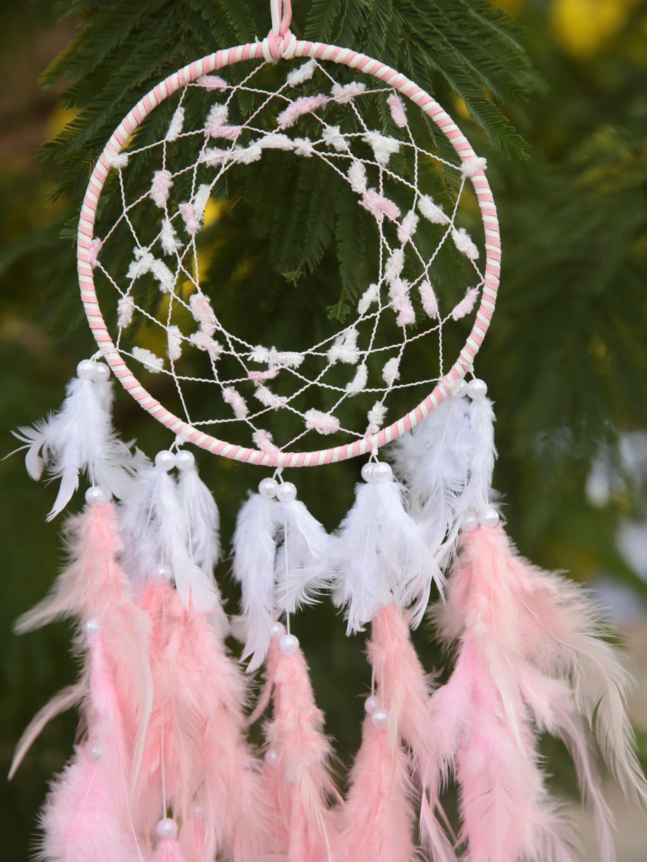 Pink and white hand woven dreamcatcher with  pink and white fluffy feathers decorated with beads. Welcome to new home gift, bedroom decor